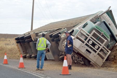 ACCIDENT: Triple Deck Semi Trailer Rolls Over At Demondrille.